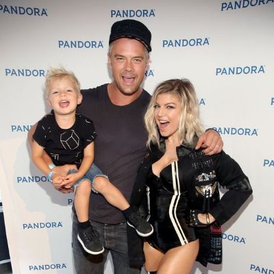 Fergie and her ex-husband Josh Duhamel took a picture with their son in Josh's arms.